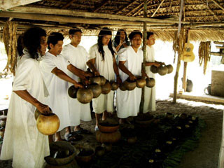 Lacandn men offering balch drinking gourds to the godpots